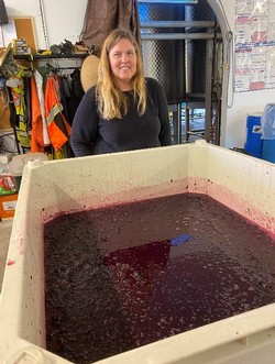 Marti Quan with fermenting red wine grape juice